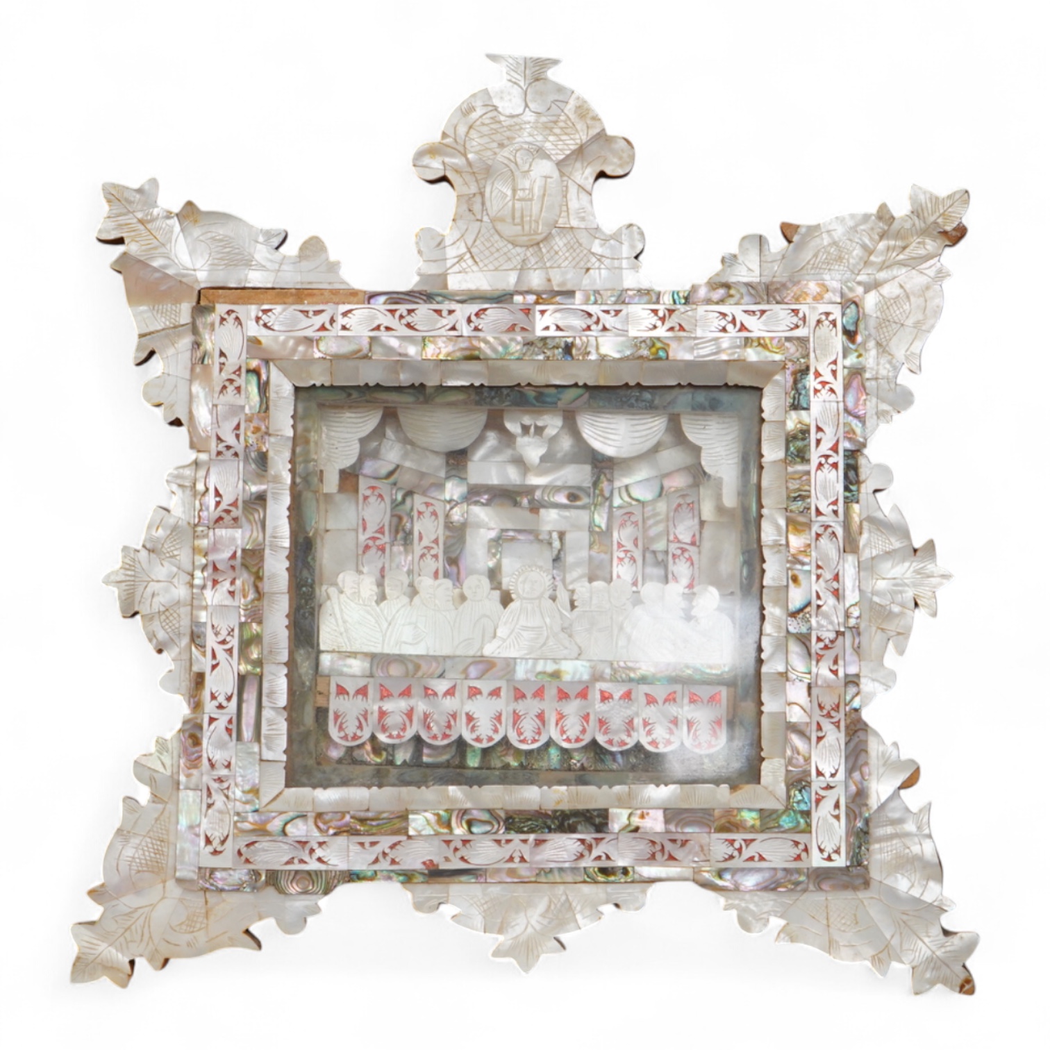 A mother of pearl carving and olivewood framed ‘The last supper’ panel, 30cm high